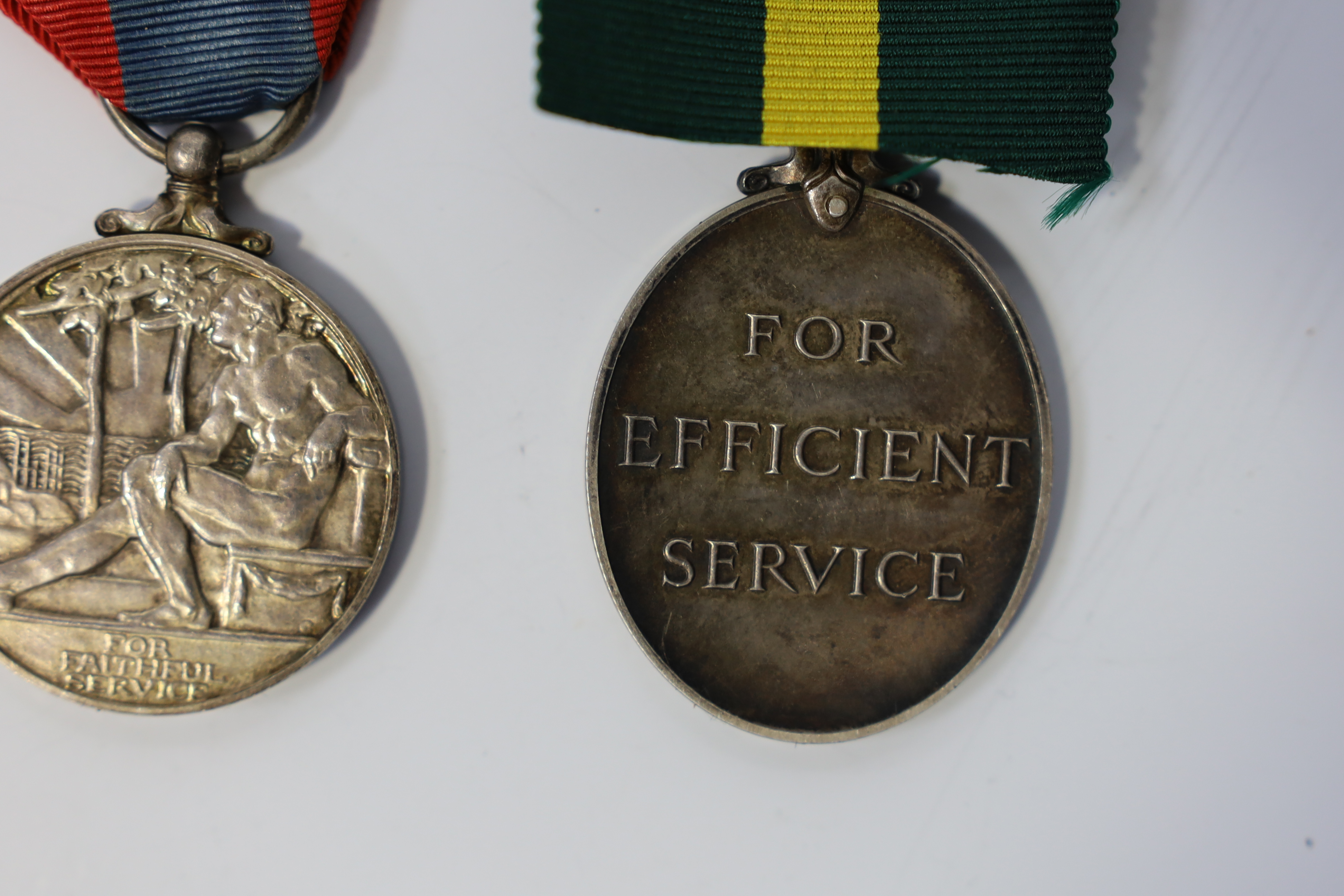 Three assorted service medals; Ed VII Volunteer Officer's Decoration hallmarked for 1905; GV Imperial Service medal to Walter Charles Cornish; GVI Territorial Efficiency medal to 2062789 . S/Sgt. L.W.Sergeant. R.A. Condi